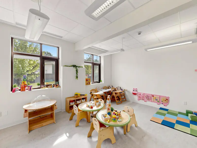Low tables, sunny windows and toys within easy reach.